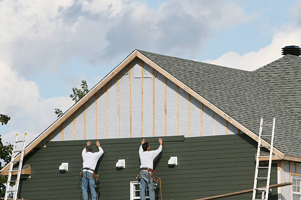 Professional Siding Installation technician working in Dundee, OH